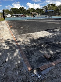 a tennis court under construction