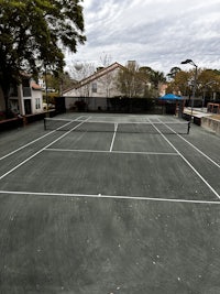 a man is playing tennis on a tennis court