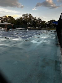 a swimming pool with a tennis racket on it